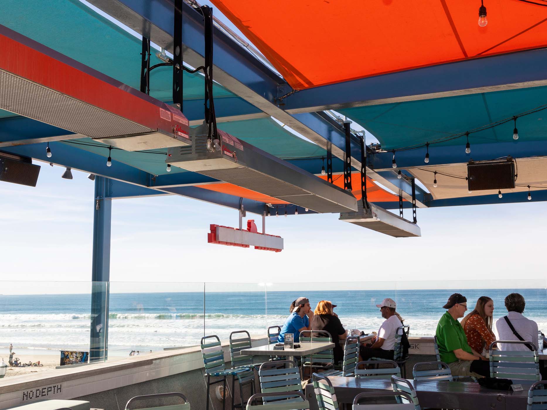 Calcana gas patio heater installed on a restaurant patio providing radiant heat