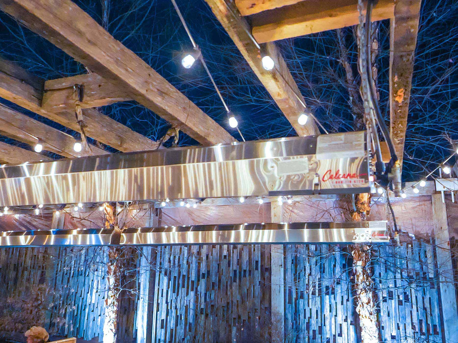 Calcana overhead infrared heater mounted on restaurant ceiling