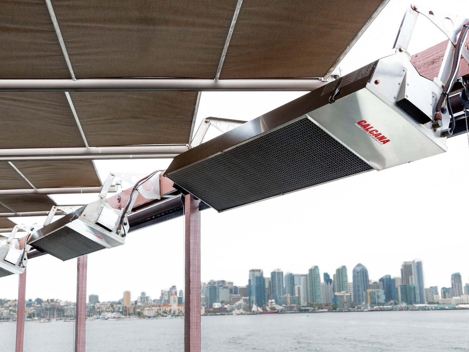 Infrared patio heaters in action during colder coastal months.