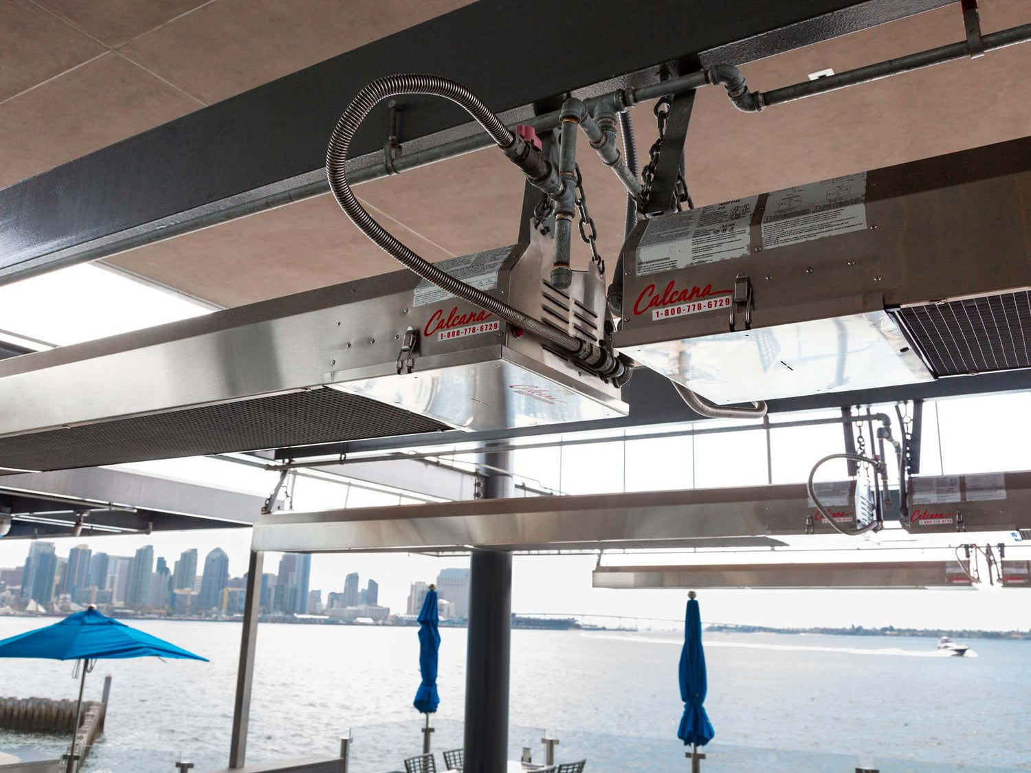 Calcana Infrared Heater Operating on Waterside Patio in Humid Coastal Conditions