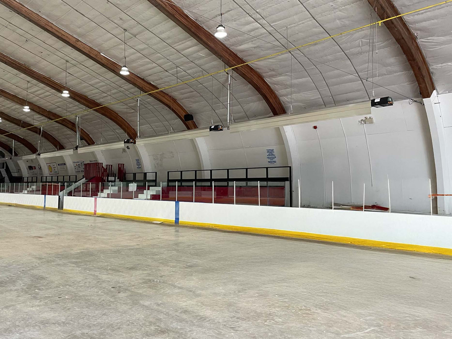 Set of Calcana Infrared Heaters Heating Large Open Area Effectively at Sundre Hockey Arena