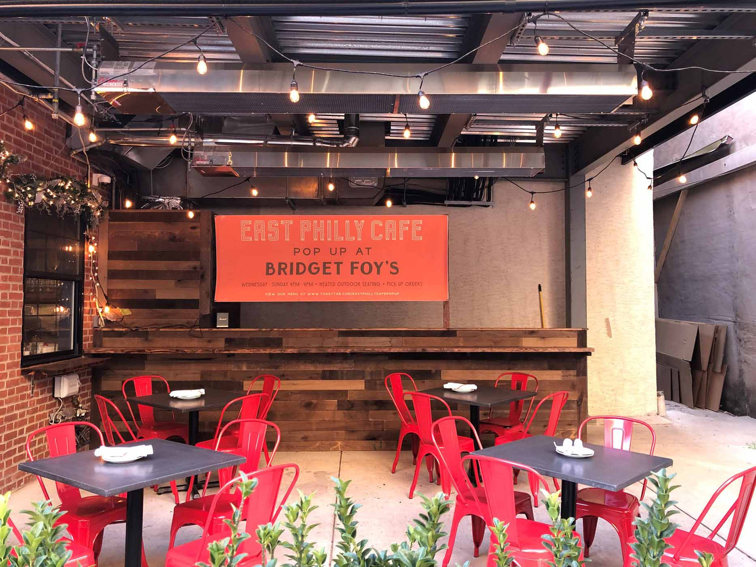 Set of Perfectly Mounted Calcana Infrared Heaters Above Restaurant Seating