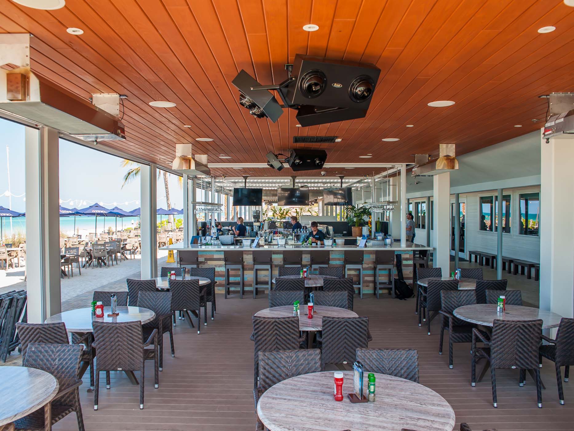 Restaurant patio with infrared heaters warming guests during spring evening dining