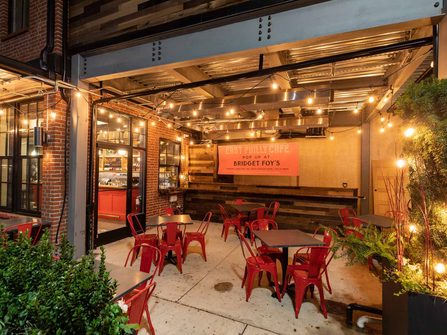 Ceiling-mounted infrared patio heater installed safely on a restaurant terrace, with clear surrounding space and secure installation.