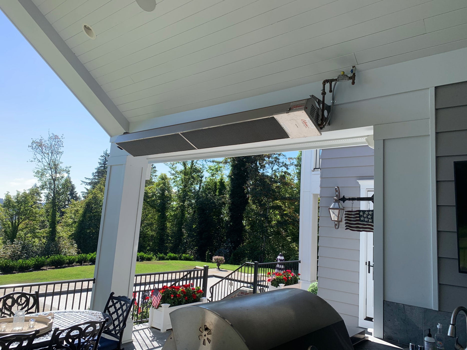 Infrared Patio Heater on Residential Patio on Angle Near BBQ & Flowers
