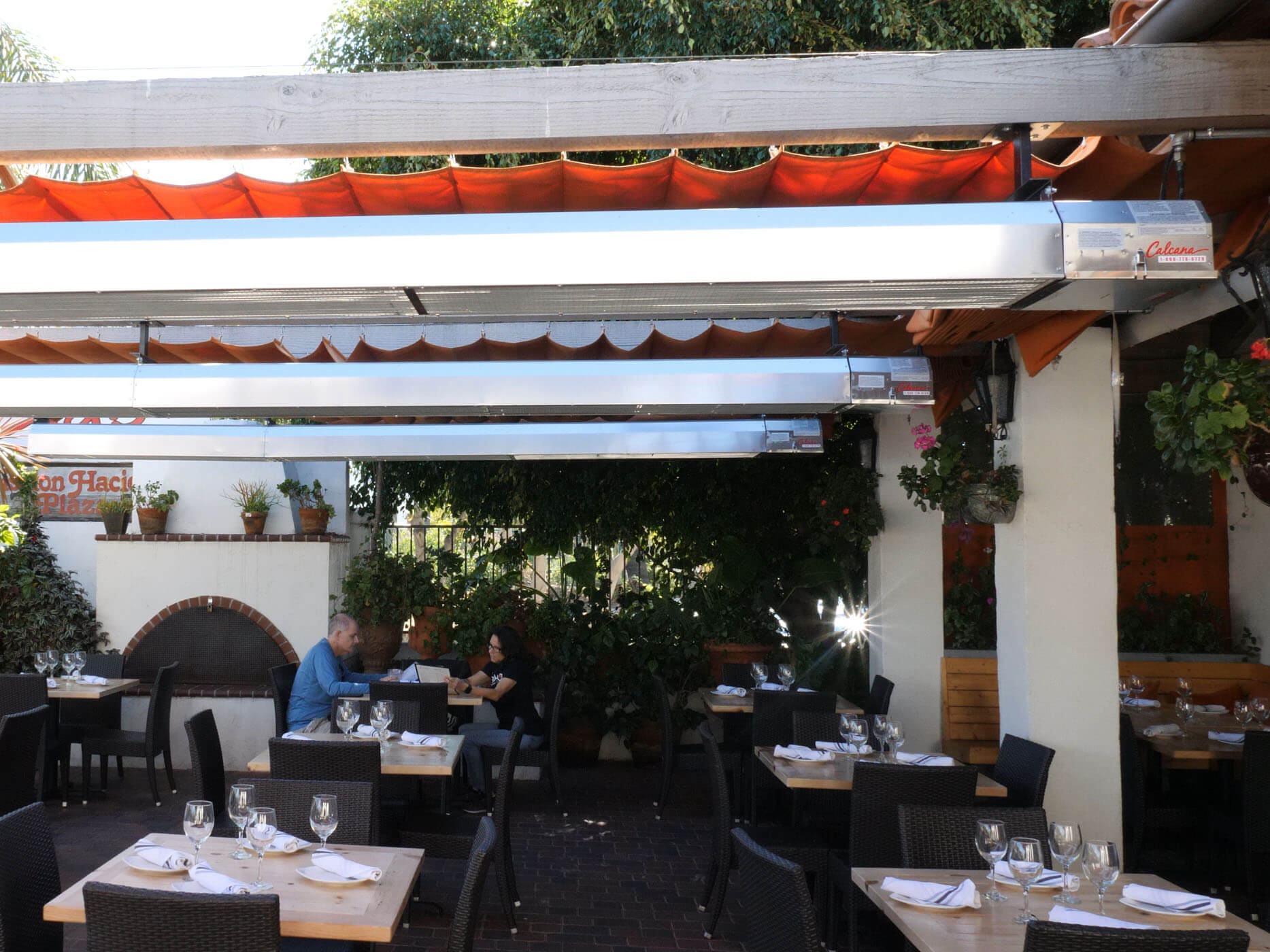 3 Infrared Patio Heaters keeping patio and people warm.