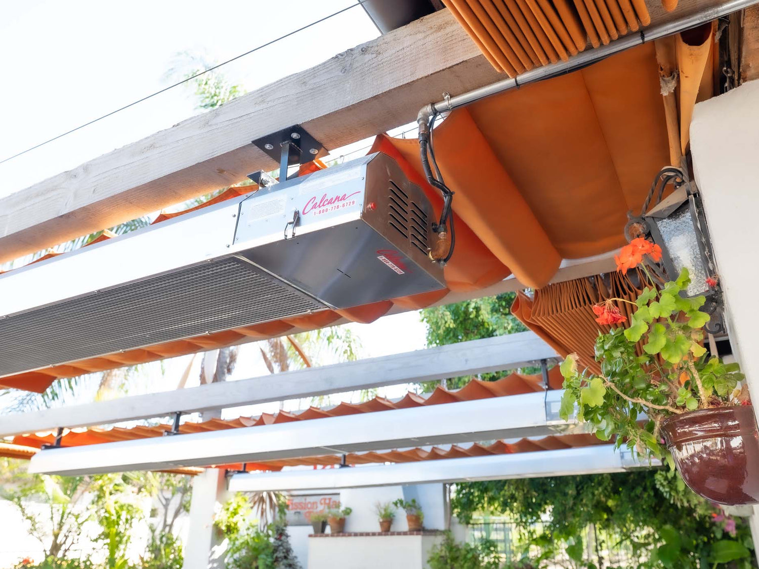 Calcana patio heaters installed outdoors, showing propane and natural gas models in use
