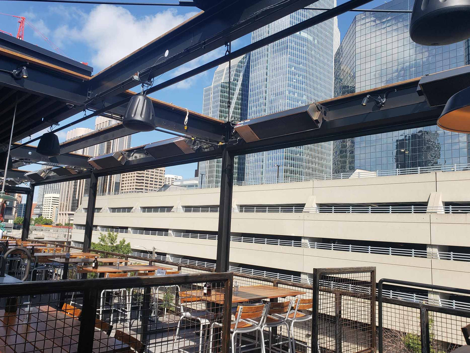 Calcana infrared patio heater installed on a wooden patio, providing radiant heat