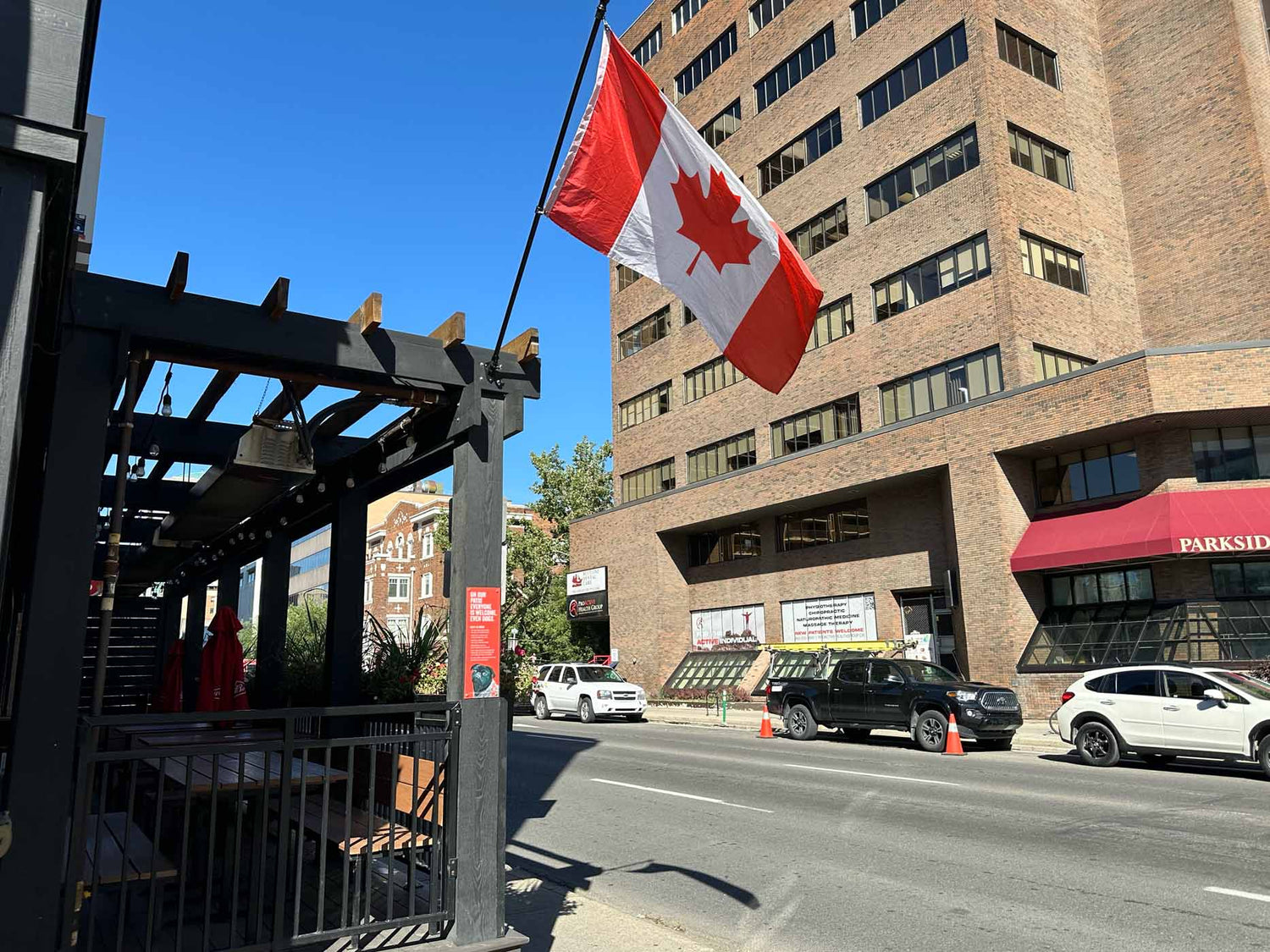 Infrared Patio Heaters on patio in downtown Calgary with Canada flag waving